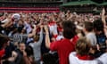 Lance Franklin of the Sydney Swans celebrates kicking his 1,000th goal with fans at the SCG