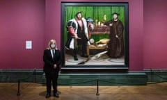 Masked and ready … a National Gallery staff member with Holbein’s The Ambassadors. 