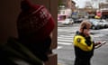 Man wearing yellow and black jacket holds a phone to his hear and looks at a notepad as a person in a red beanie looks at him