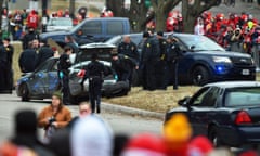 Police search a vehicle after Tuesday’s chase in Kansas City