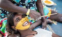 A young Gumatj girl being painted up in her clan’s traditional colours for bunggul (ceremonial dancing) at the Garma Festival in northeast Arnhem Land.