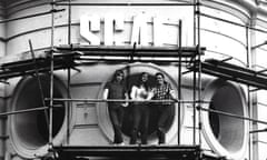 Stephen Woolley, right, and colleagues on scaffolding outside the Scala cinema in 1981.