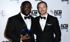 Director Steve McQueen, left, with actor Michael Fassbender who presented him with the award.