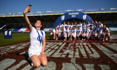 The England wing Jess Breach takes a photo with her teammates after victory at Twickenham Stoop.