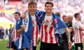 Sunderland's Callum Doyle  and Dennis Cirkin celebrate after the final whistle.