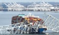 FILES-US-TRANSPORT-ACCIDENT-BALTIMORE-FBI<br>(FILES) In this aerial image, the steel frame of the Francis Scott Key Bridge sits on top of a container ship after the bridge collapsed, Baltimore, Maryland, on March 26, 2024. The US Federal Bureau of Investigation (FBI) has launched a criminal probe targeting the container ship that crashed into a major road bridge in Baltimore last month, collapsing it and killing six people, US media reported on April 15, 2024. (Photo by Jim WATSON / AFP) (Photo by JIM WATSON/AFP via Getty Images)