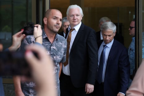 Julian Assange leaves court