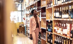 Businesswoman searching for a wine. How much? the increase in UK duty has put an average 10% on an average 11.5-14.5% ABV bottle of wine.