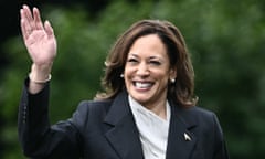 A smiling Kamala Harris pictured waving