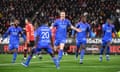 Nemanja Matic turns away in disappointment as Lyon players celebrate.