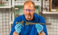 John Belgrove examines two parts of the sword he discovered. The objects have been bought by Dorset Museum.