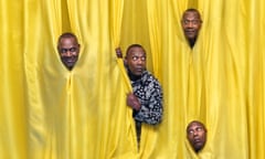 Lenny Henry's head five times, looking out from behind yellow curtains above a turquoise floor