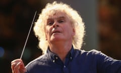 Sir Simon Rattle conducts an orchestra.