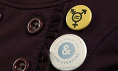 A button that reads, "Safety and Access for Everyone," is worn by a person opposing a bill that would eliminate Washingtons new rule allowing transgender people use gender-segregated bathrooms and locker rooms in public buildings consistent with their gender identity, Wednesday, Jan. 27, 2016, outside a Washington Senate hearing room at the Capitol in Olympia, Wash. (AP Photo/Ted S. Warren)