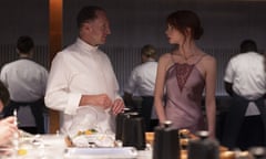 Ralph Fiennes and Anya Taylor-Joy in The Menu.