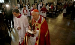Cardinal Vincent Nichols carries a relic