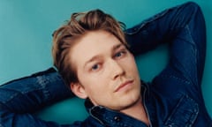 Head shot of actor Joe Alwyn in denim shirt