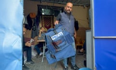 A man holds the flak jacket belonging to Al Jazeera journalist Wael Dahdouh