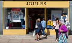 Shoppers in front of a Joules store as the sun shines