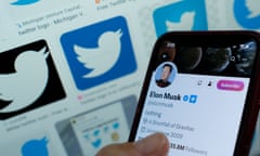 Elon Musk's blue tick next to his name on a smartphone on Twitter