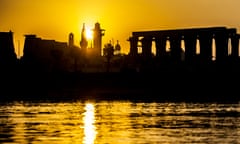 Silhouette of the skyline showing part of a church, mosque and temple