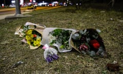 Floral tributes lie next to a road near the site of a bus crash in the Hunter Valley