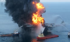 TO GO WITH AFP STORY BY ANDREW BEATTY (FILES) This file handout photo taken on April 21, 2010 by the US Coast Guard shows fire boat response crews as they battle the blazing remnants of the BP operated off shore oil rig, Deepwater Horizon, in the Gulf of Mexico. The White House blocked new leases for oil and gas drilling in sections of the Arctic and Atlantic on December 20, 2016, a high-stakes bid to forestall exploration and tie Donald Trump’s hands. The Hawaii-born president’s second year in office was dominated by the catastrophic Deepwater Horizon oil spill, which poured millions of barrels of oil into the Gulf of Mexico. The spill could not be stopped for 87 days, devastating wildlife and fishing-dependent communities in Louisiana, Mississippi, Florida, and Alabama. / AFP PHOTO / US Coast Guard / HO / RESTRICTED TO EDITORIAL USE - MANDATORY CREDIT “AFP PHOTO / US COAST GUARD” - NO MARKETING NO ADVERTISING CAMPAIGNS - DISTRIBUTED AS A SERVICE TO CLIENTS HO/AFP/Getty Images