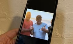 Phone showing frame from Labor attack ad on Scott Morrison, of a photo of the prime minister on holiday in Hawaii