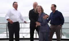 Malcolm Turnbull steadies Lucy Turnbull aboard a boat with the environment minister, Greg Hunt, and the member for Herbert, Ewen Jones, during a brief trip to Magnetic Island off Townsville on Monday morning