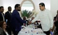 Venezuela's President Nicolas Maduro (R) shakes hand with Guyana's President Irfaan Ali (L) during a meeting in Saint Vincent and The Grenadines.
