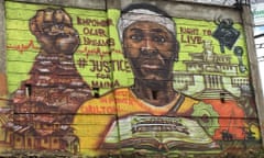 A mural at an entrance to Kibera slum calls for justice for the death of Carilton Maina.