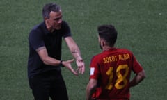 Spain head coach Luis Enrique talks to player Jordi Alba.