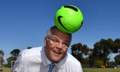 Scott Morrison heads a soccer ball