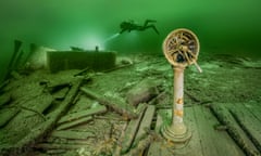 A diver exploring a shipwreck