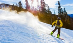 Teenager snowboarding in Taos, New Mexico