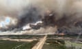 Smoke rising from mutual aid wildfire HTZ001 which flared due to strong winds, near Indian Cabins, Alberta, Canada, in May 2024.