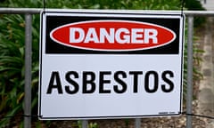 Asbestos signs are displayed at a park