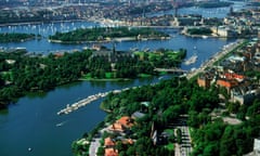 View of lush green islands around sailboats, shorelines and bridges of Stockholm in summer from the air<br>C939WA View of lush green islands around sailboats, shorelines and bridges of Stockholm in summer from the air