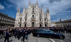 Mourners applaud as the hearse carrying the casket of former Italian premier Silvio Berlusconi leaves after his state funeral inside Milan's cathedral