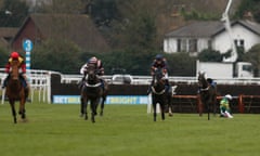 Barry Geraghty on the turf at Kempton following his fall from Charli Parcs at Kempton