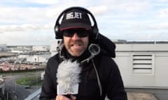 Jerry Dyer looking very windswept on a rooftop at Heathrow.