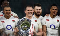 dylan hartley with triple crown trophy