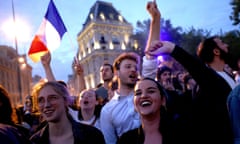 Leftwing alliance supporters cheer and wave the French flag in the Place de la République.