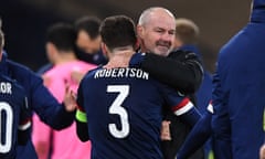 The Scotland manager, Steve Clarke, embraces Andy Robertson after Scotland beat Israel in the Euro 2020 playoff semi-final.