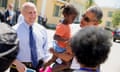 Barack Obama, Mitch Landrieu<br>President Barack Obama, accompanied by New Orleans Mayor Mitch Landrieu, left, holds a young girl as he greets residents in the the Tremé neighborhood in New Orleans, Thursday, Aug. 27, 2015, for the 10th anniversary since the devastation of Hurricane Katrina. Tremé is one of the oldest black neighborhoods in America, which borders the French Quarter just north of Downtown. (AP Photo/Andrew Harnik)