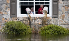 Flood Waters From Hurricane Florence Begin To Flood Parts Of South Carolina<br>LONGS, SC - SEPTEMBER 20: A couple bails out their flooded home on September 20, 2018 in Longs, South Carolina. Floodwaters are expected to rise through the weekend in the area. (Photo by Sean Rayford/Getty Images)