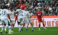 Cologne's Faride Alidou climbs highest to score his side's second goal against Borussia Mönchengladbach but the visitors had to settle for a 3-3 draw