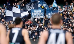 Carlton supporters celebrate at the MCG during the Blues’ one-point win over Hawthorn on Sunday.