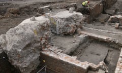 An archaeologist works on the exposed remains of Shakespeare’s Curtain theatre