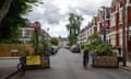 A cyclist passes through a low traffic neighbourhood (LTN) barrier on August 1, 2023 in London, England.